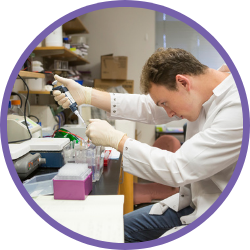 Researcher in lab with pipette