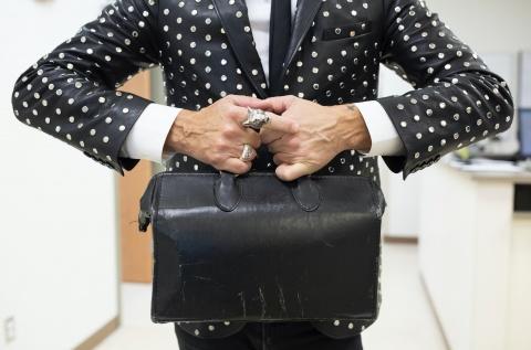 Bedlack with briefcase