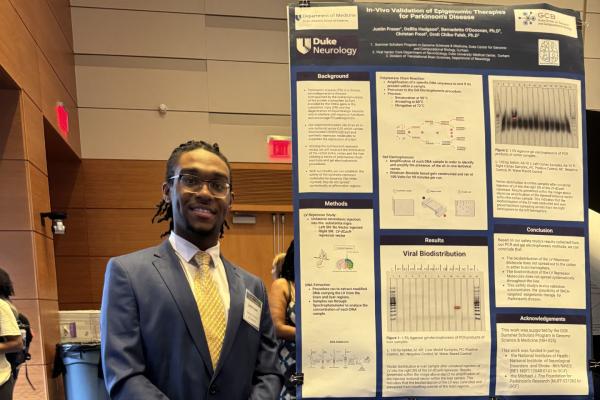 Summer Rotation Student, Justin Fraser and poster.