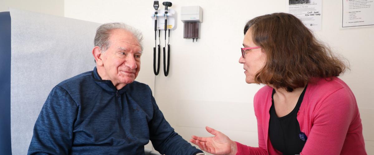 Dr. Johnson with Patient in Clinic