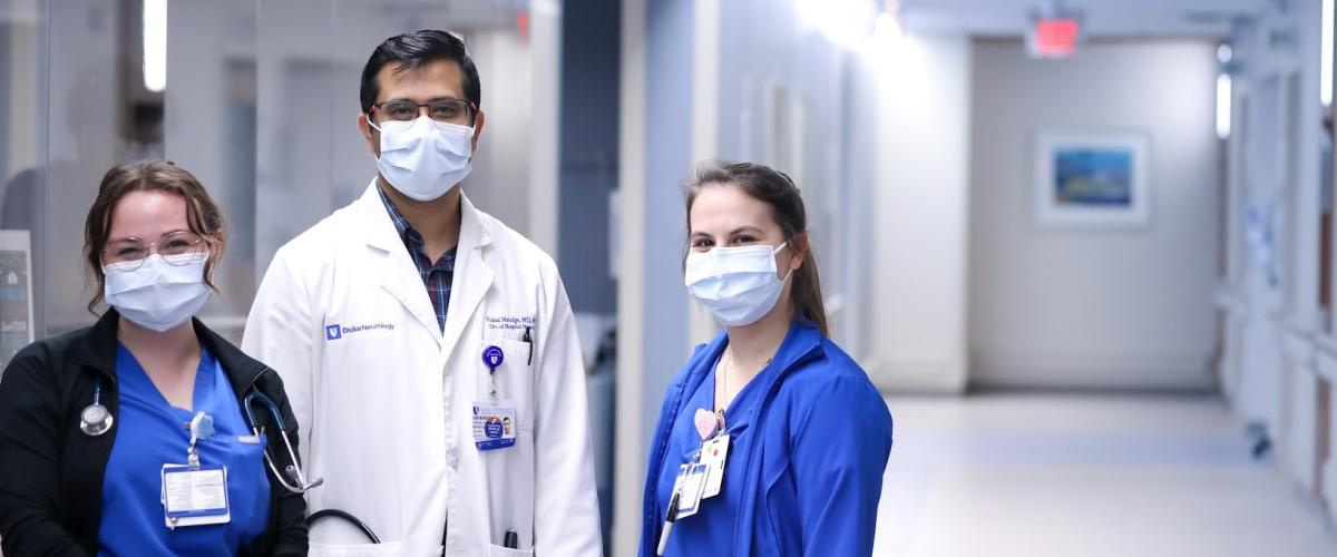 V Mandge and nurses in intensive care unit smiling