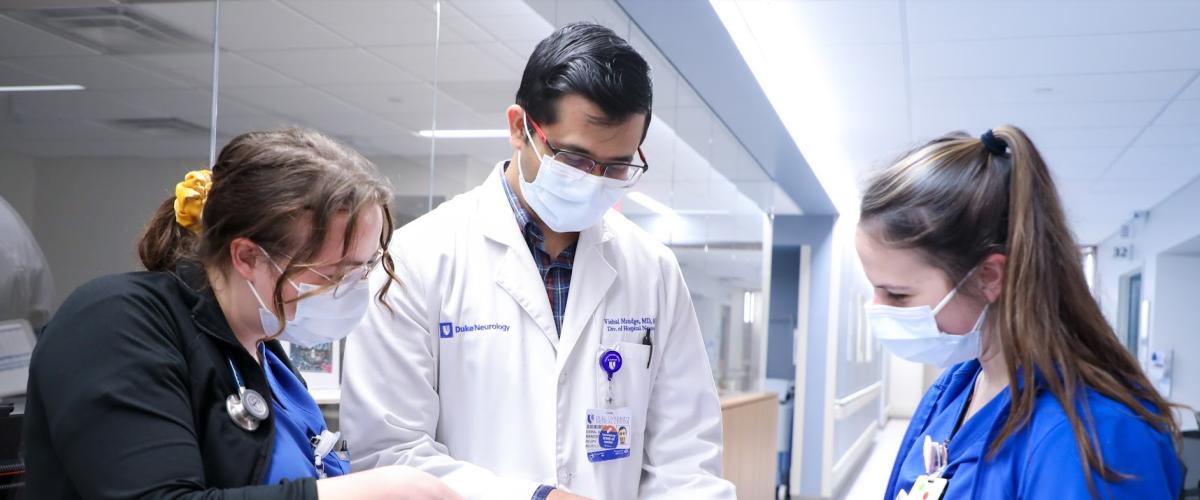 V Mandge with nurses in intensive care unit