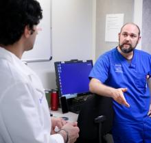 doctor talking to colleague in hallway